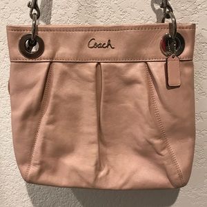 Pearl Pink COACH purse.